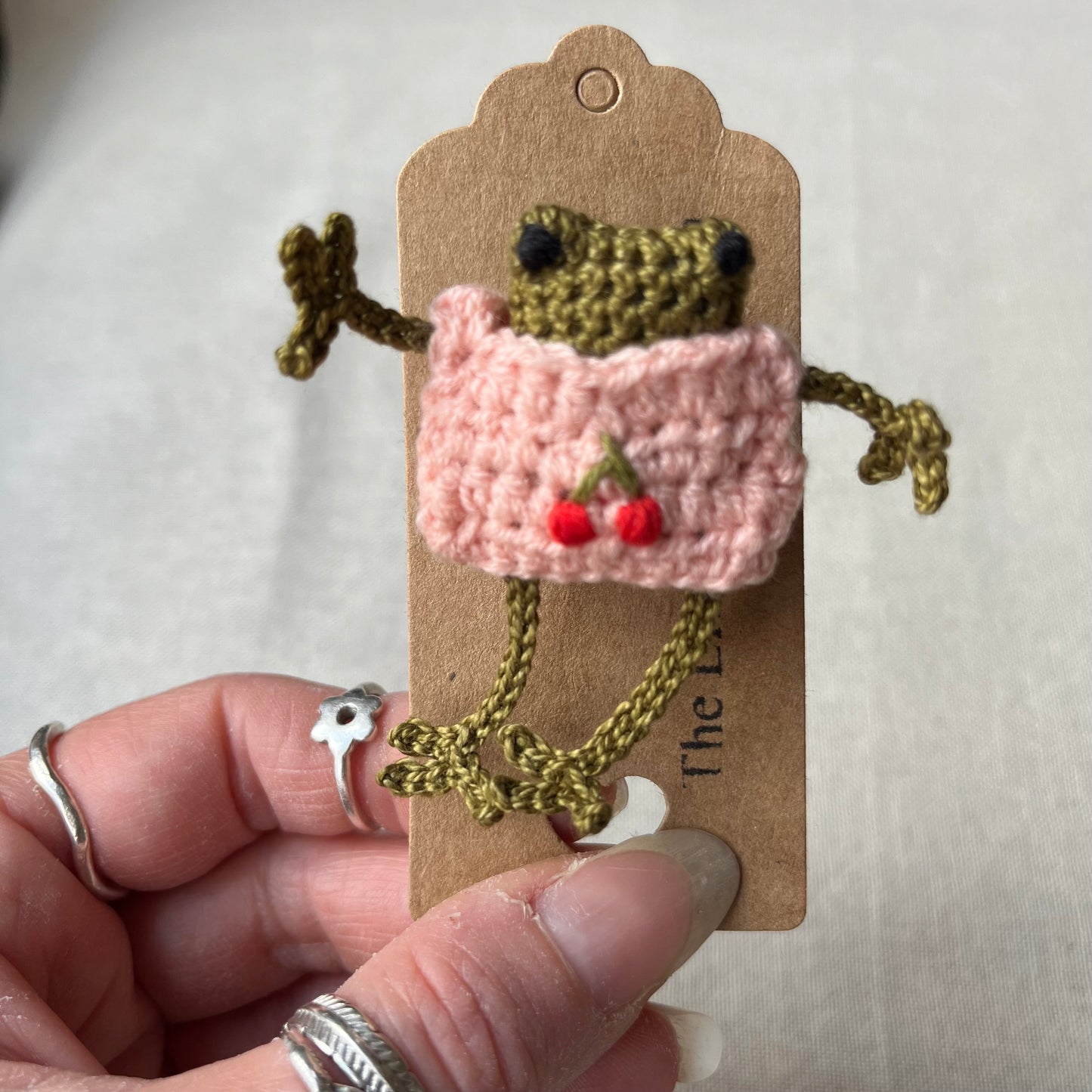 Frog in a jumper brooch